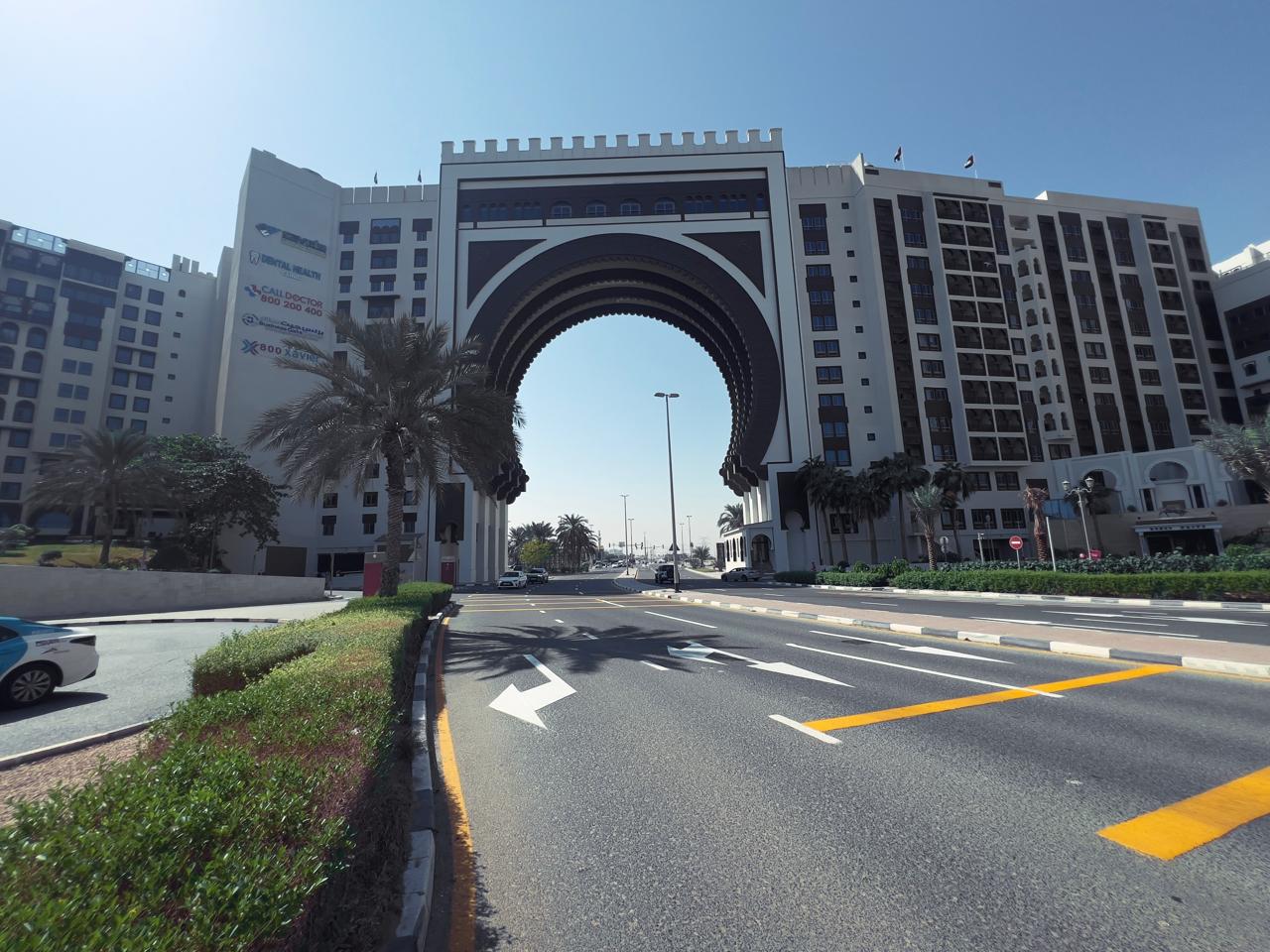 Ibn Battuta Gate building exterior and central arch, home to Dental Health Clinic