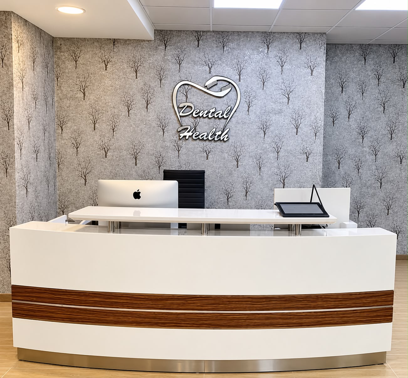 Dental Health Clinic reception with its tooth-heart logo behind the white front desk